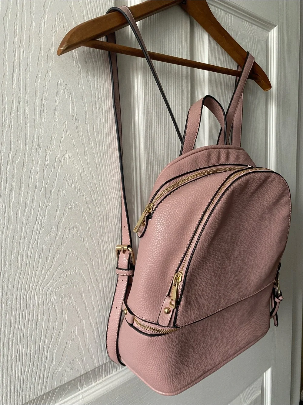 Blush Pink Mini Backpack with Gold Hardware and Striped Lining.